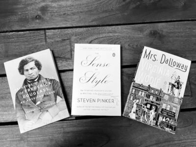 A black and white picture of three books
