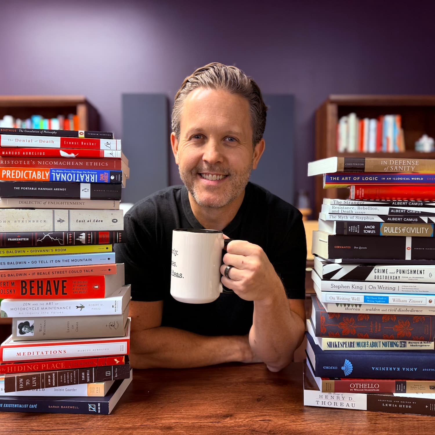 Eddy Hood with stacks of books